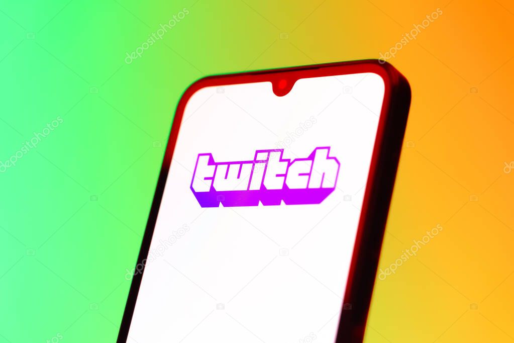 Prague, Czechia - 10 21 2024: Smartphone on surface showing Twitch logo.