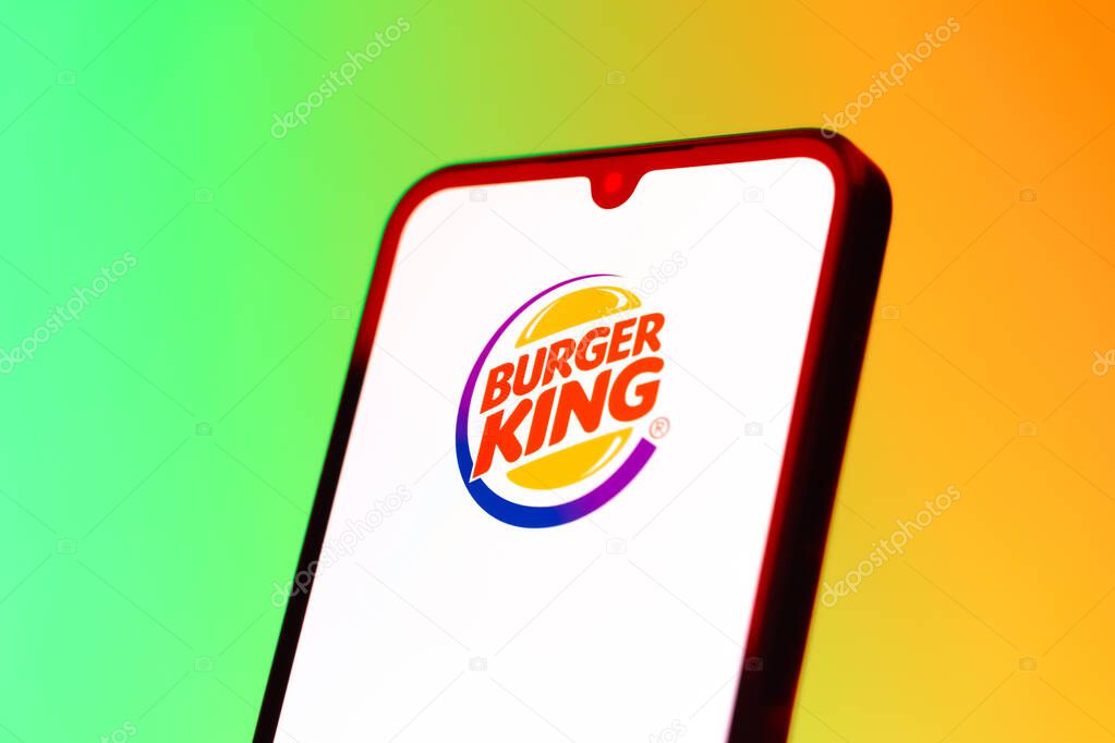 Prague, Czechia - 10 21 2024: Smartphone on surface showing Burger King logo.