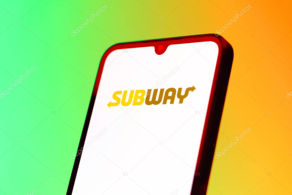 Prague, Czechia - 10 21 2024: Smartphone on surface showing Subway logo.