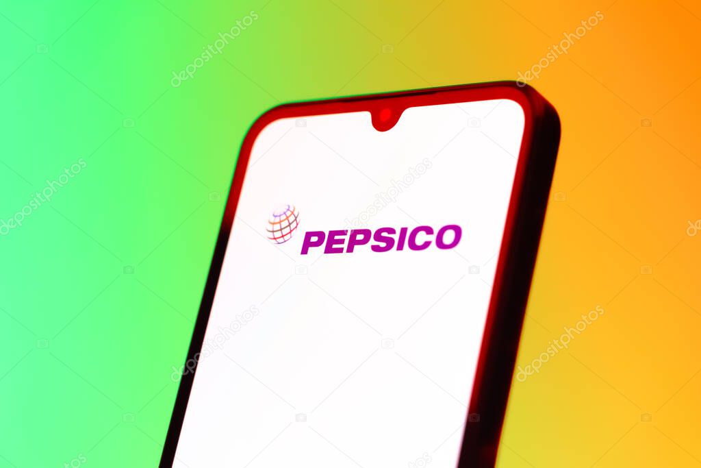 Prague, Czechia - 10 21 2024: Smartphone on surface showing Pepsico logo.