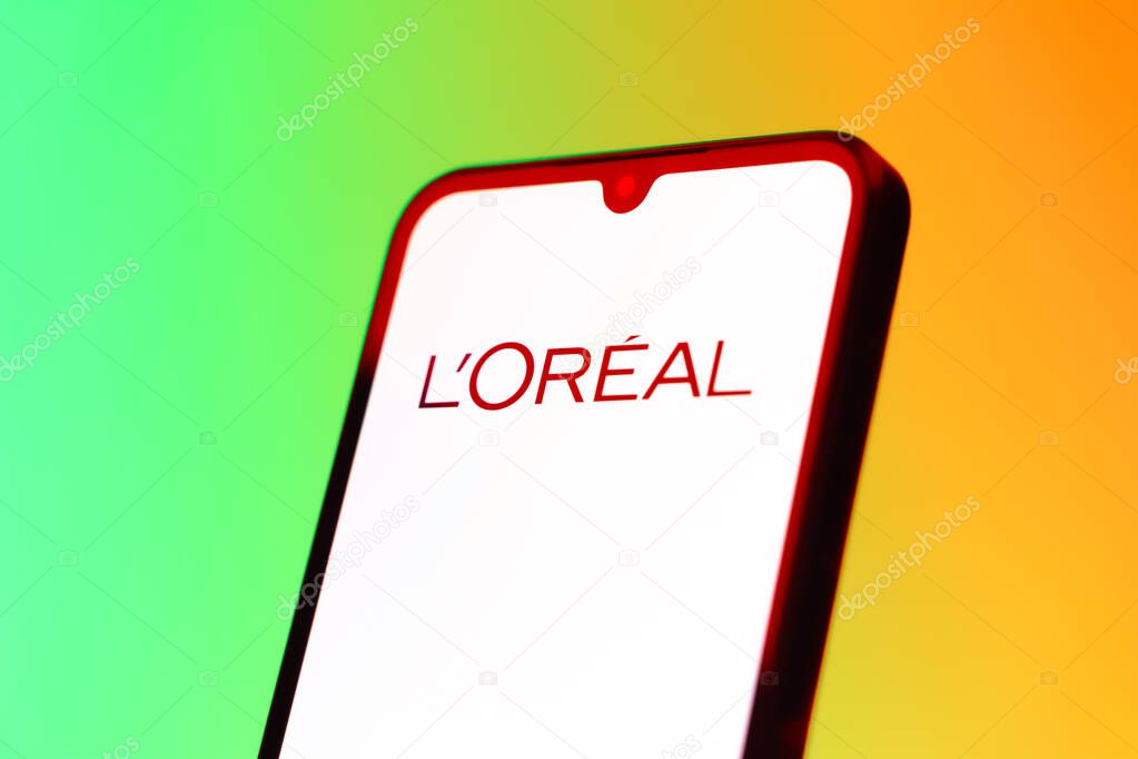 Prague, Czechia - 10 21 2024: Smartphone on surface showing L'Oreal logo.