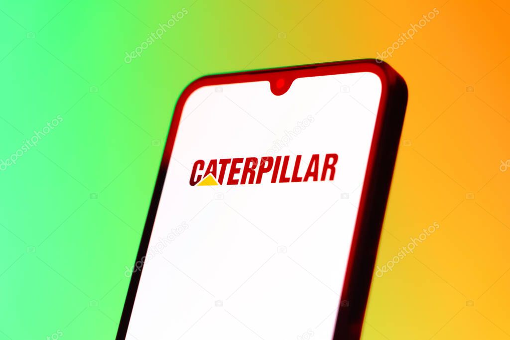 Prague, Czechia - 10 21 2024: Smartphone on surface showing Caterpillar logo.