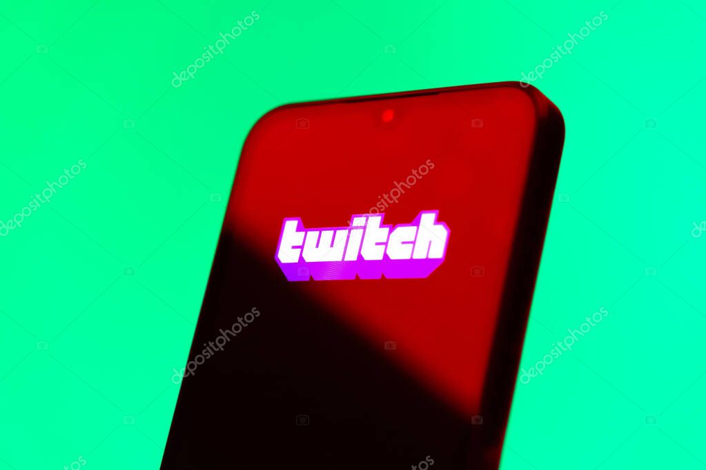 Prague, Czechia - 10 21 2024: Smartphone on surface showing Twitch logo.