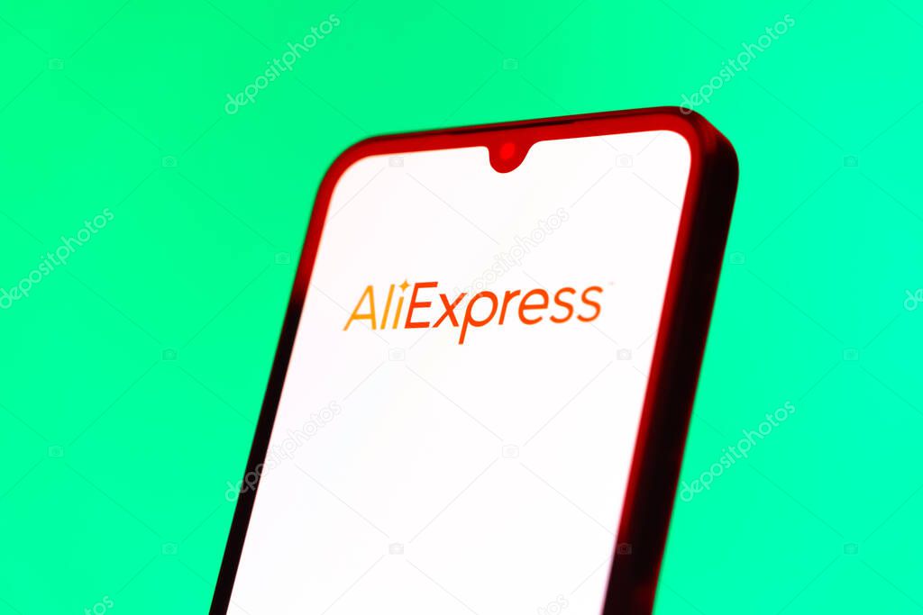 Prague, Czechia - 10 21 2024: Smartphone on surface showing AliExpress logo.