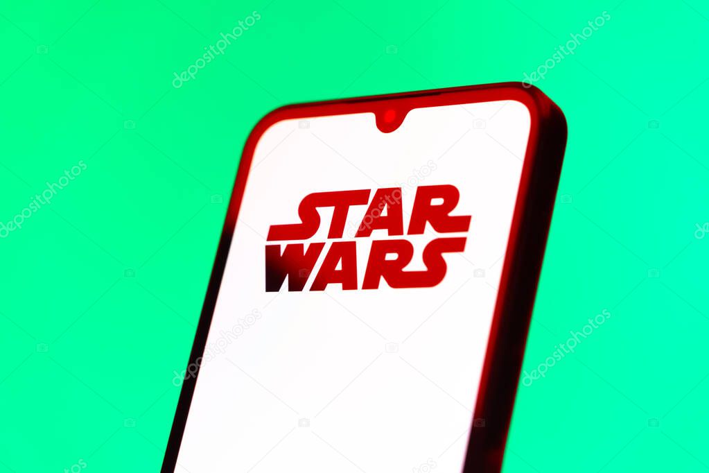 Prague, Czechia - 10 21 2024: Smartphone on surface showing Star Wars logo.