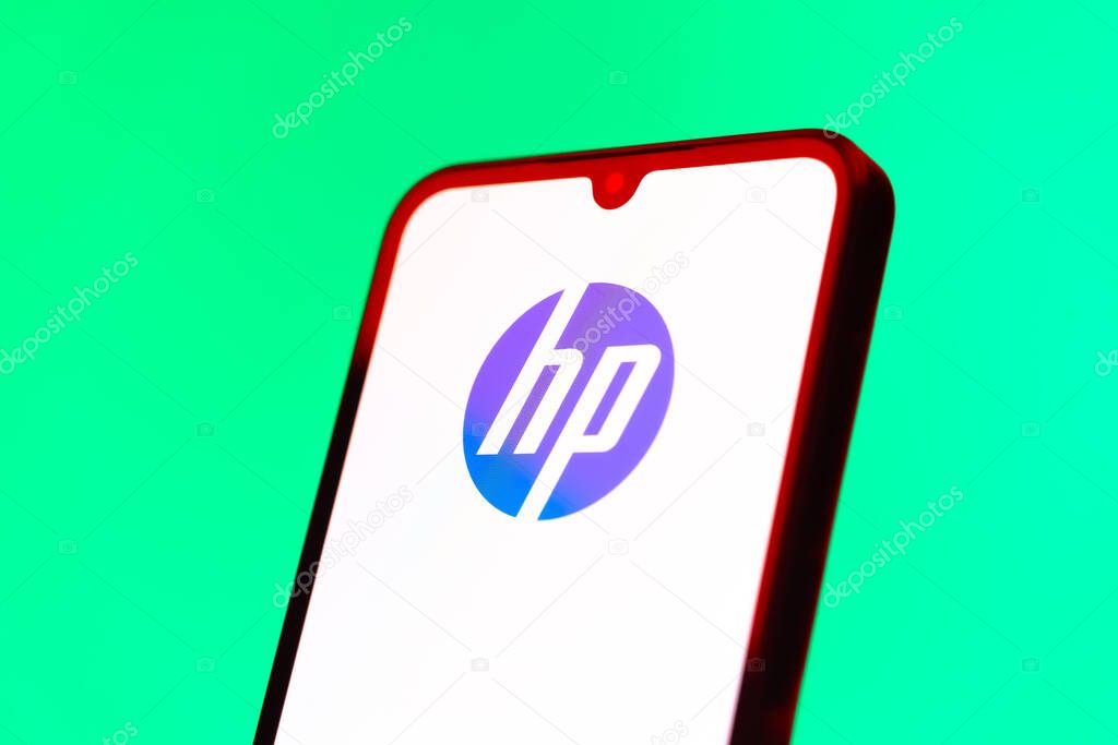Prague, Czechia - 10 21 2024: Smartphone on surface showing Hewlett-Packard logo.