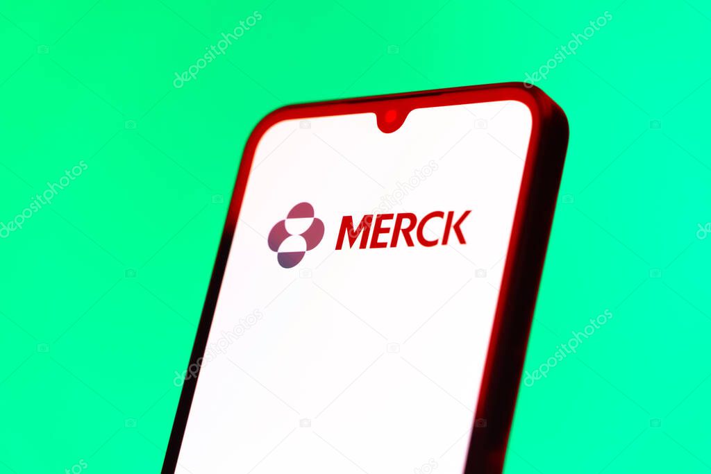 Prague, Czechia - 10 21 2024: Smartphone on surface showing Merck logo.