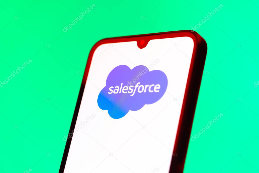 Prague, Czechia - 10 21 2024: Smartphone on surface showing Salesforce logo.