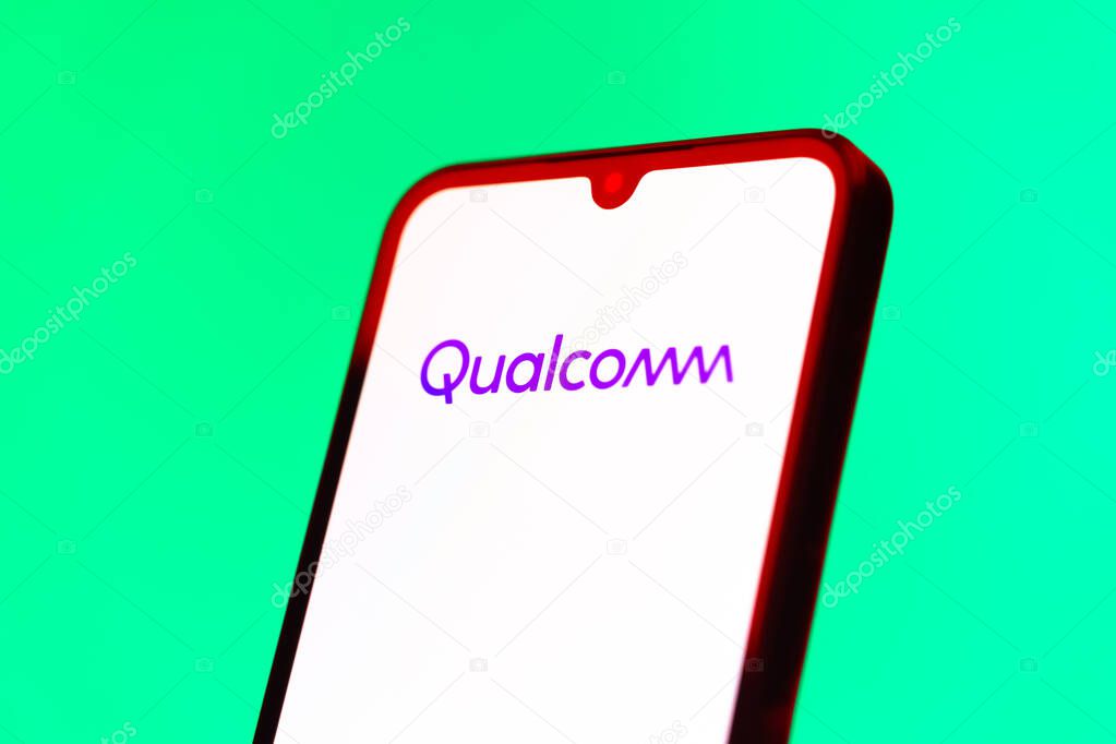 Prague, Czechia - 10 21 2024: Smartphone on surface showing Qualcomm logo.