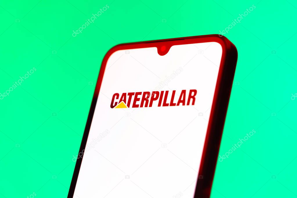 Prague, Czechia - 10 21 2024: Smartphone on surface showing Caterpillar logo.