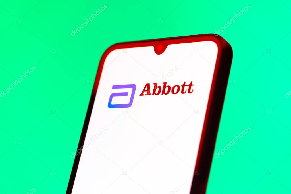 Prague, Czechia - 10 21 2024: Smartphone on surface showing Abbott Laboratories logo.
