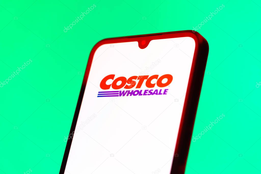 Prague, Czechia - 10 21 2024: Smartphone on surface showing Costco logo.