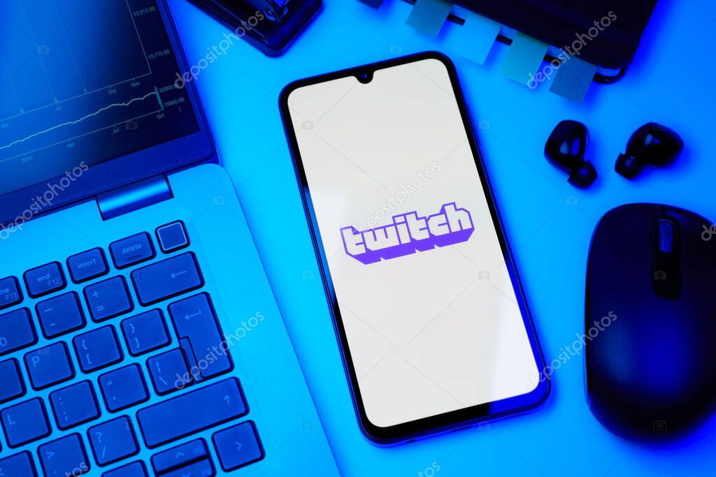 Prague, Czechia - 10 21 2024: Smartphone on surface showing Twitch logo.