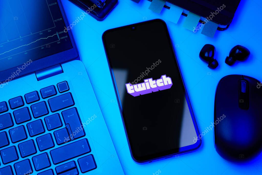 Prague, Czechia - 10 21 2024: Smartphone on surface showing Twitch logo.