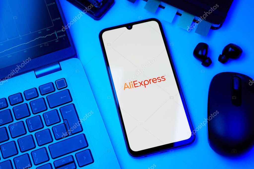 Prague, Czechia - 10 21 2024: Smartphone on surface showing AliExpress logo.