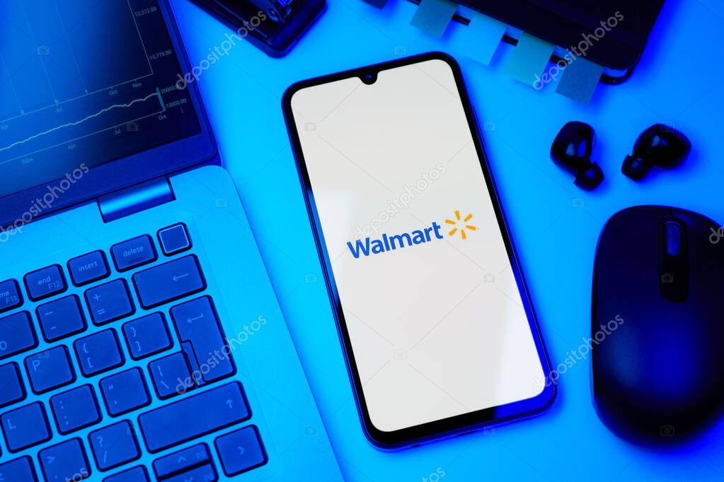 Prague, Czechia - 10 21 2024: Smartphone on surface showing Walmart logo.