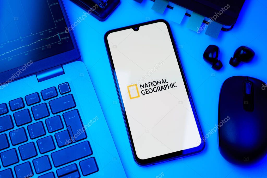Prague, Czechia - 10 21 2024: Smartphone on surface showing National Geographic logo.