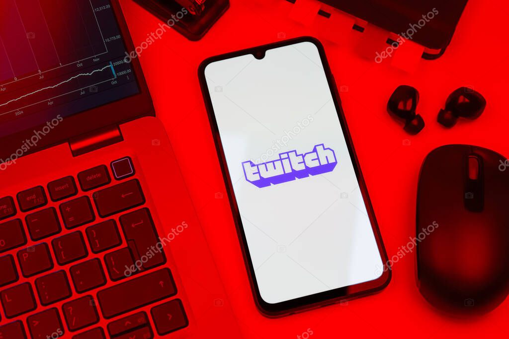 Prague, Czechia - 10 21 2024: Smartphone on surface showing Twitch logo.