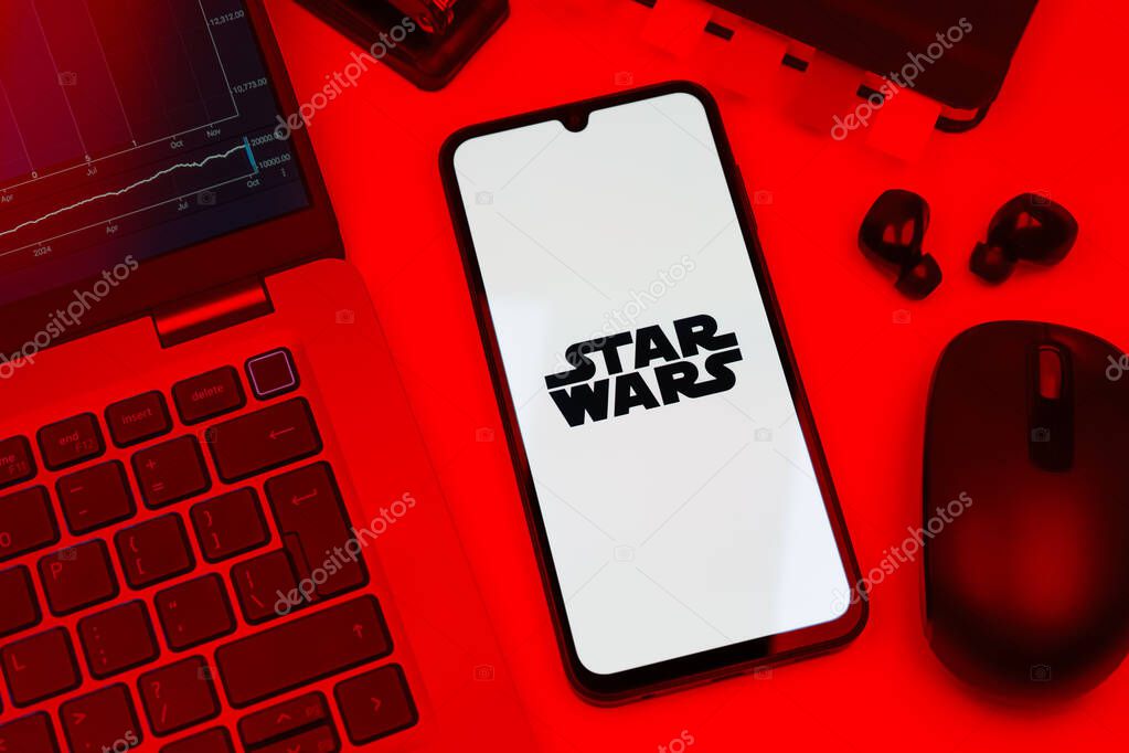 Prague, Czechia - 10 21 2024: Smartphone on surface showing Star Wars logo.