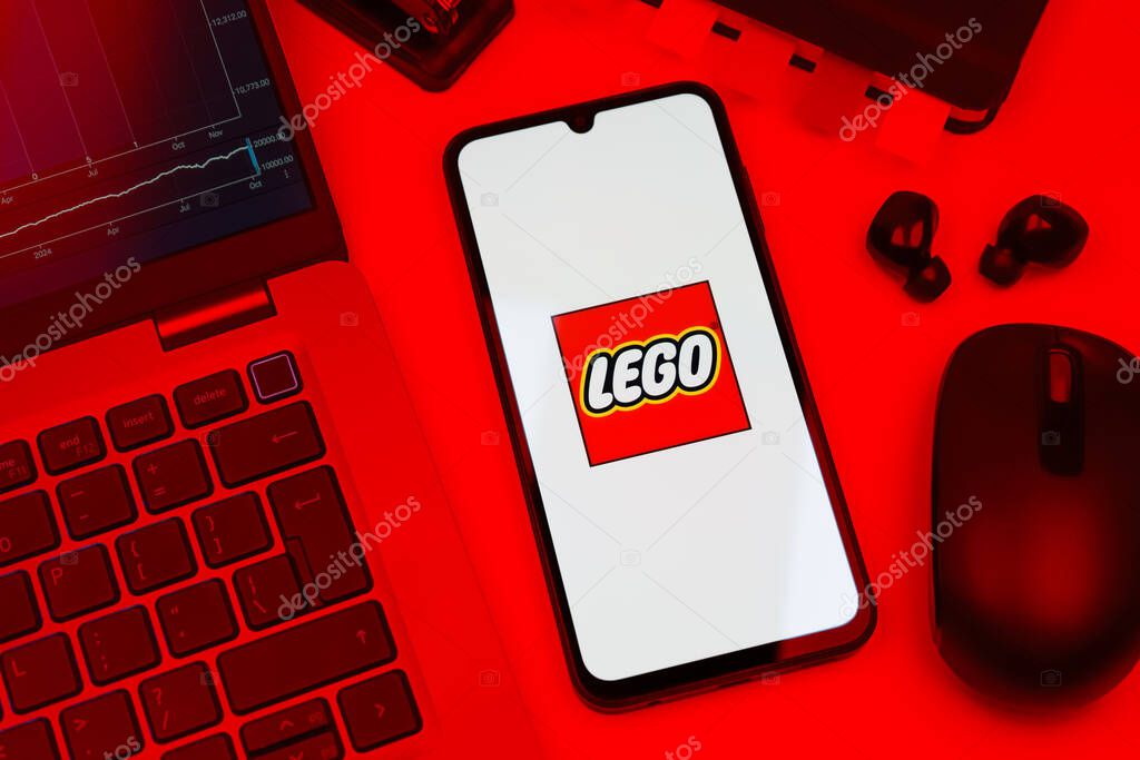 Prague, Czechia - 10 21 2024: Smartphone on surface showing Lego logo.