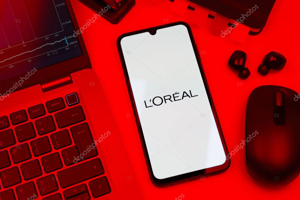 Prague, Czechia - 10 21 2024: Smartphone on surface showing L'Oreal logo.
