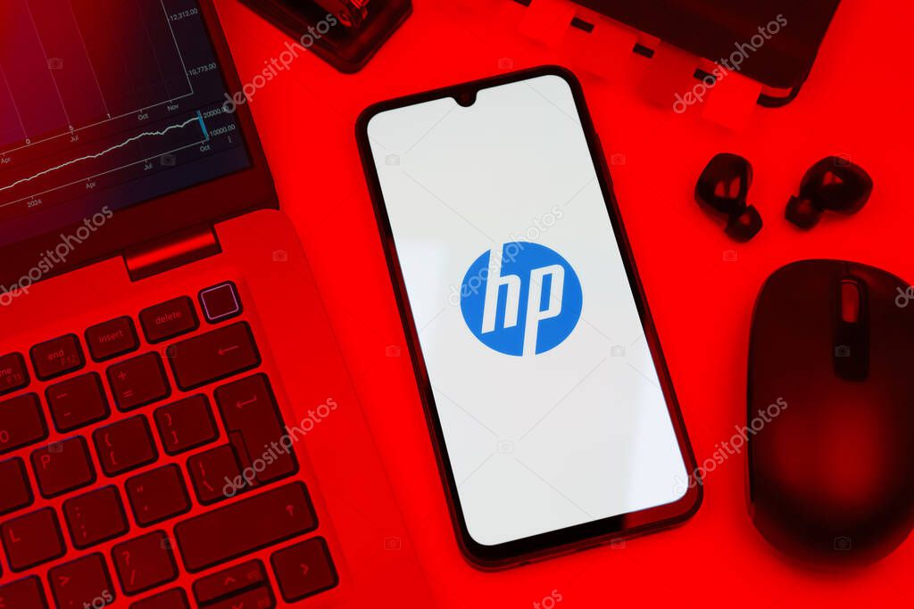 Prague, Czechia - 10 21 2024: Smartphone on surface showing Hewlett-Packard logo.