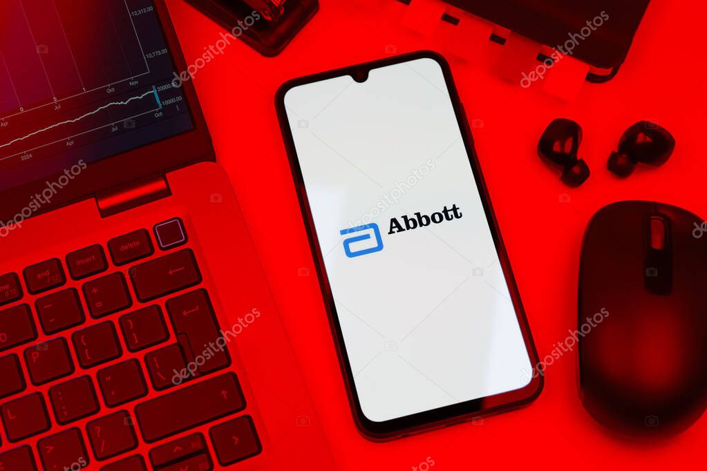 Prague, Czechia - 10 21 2024: Smartphone on surface showing Abbott Laboratories logo.