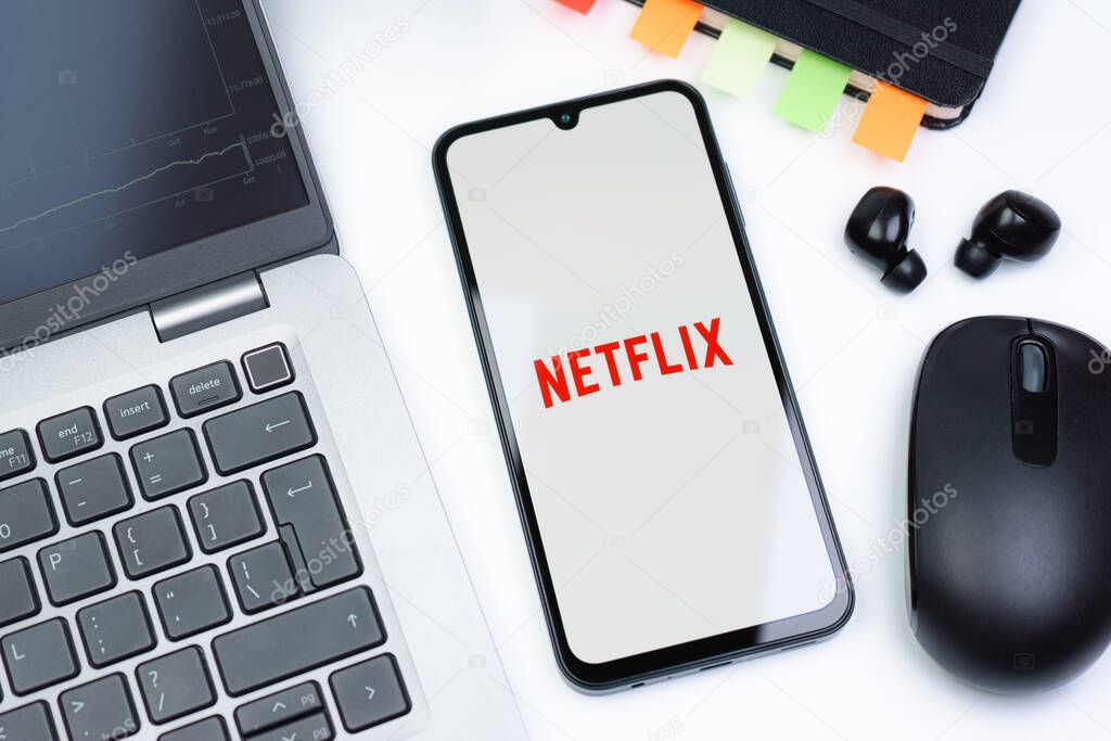 Prague, Czechia - 10 21 2024: Smartphone on surface showing Netflix logo.