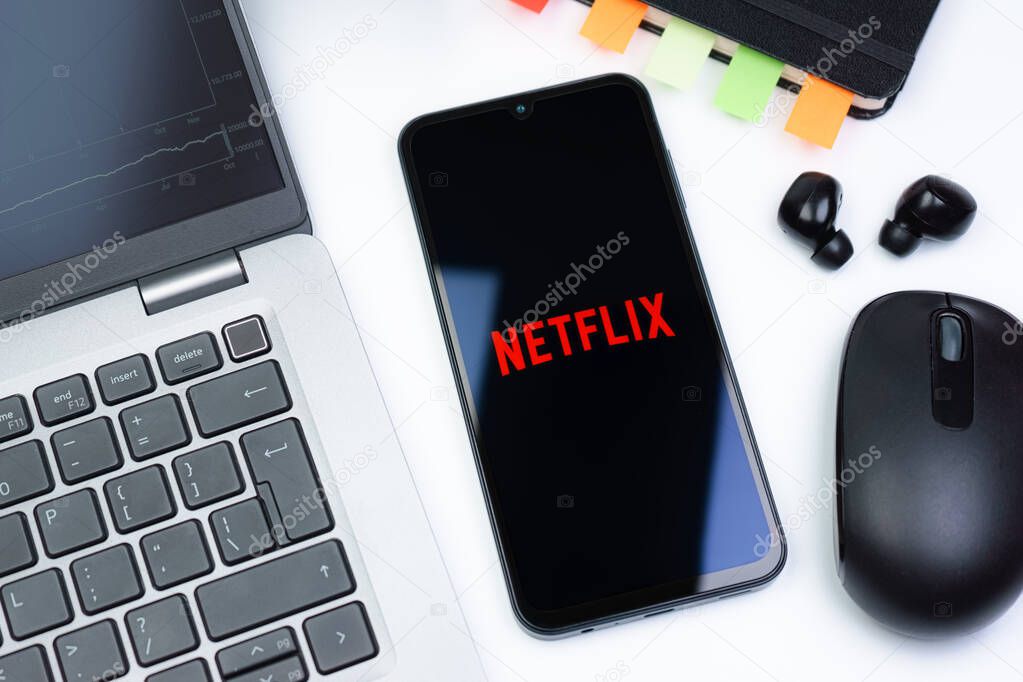 Prague, Czechia - 10 21 2024: Smartphone on surface showing Netflix logo.