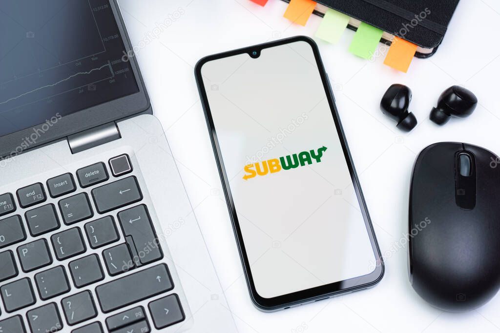 Prague, Czechia - 10 21 2024: Smartphone on surface showing Subway logo.