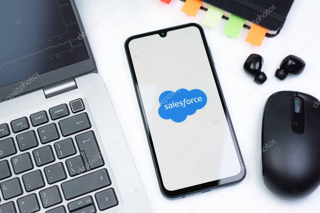 Prague, Czechia - 10 21 2024: Smartphone on surface showing Salesforce logo.