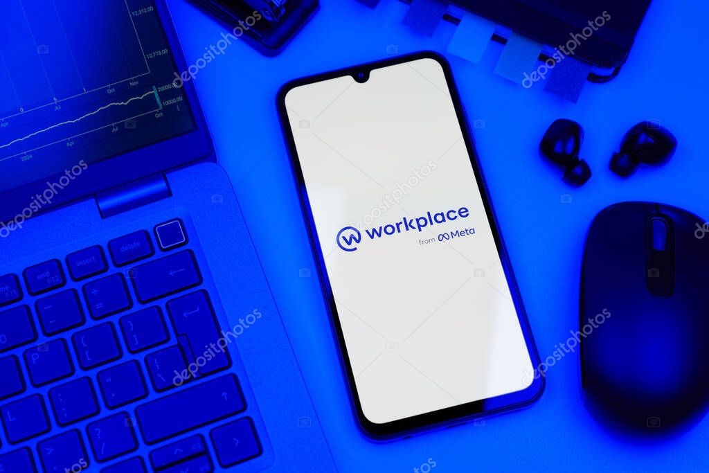 Prague, Czechia - 10 21 2024: Smartphone on surface showing Workplace logo.