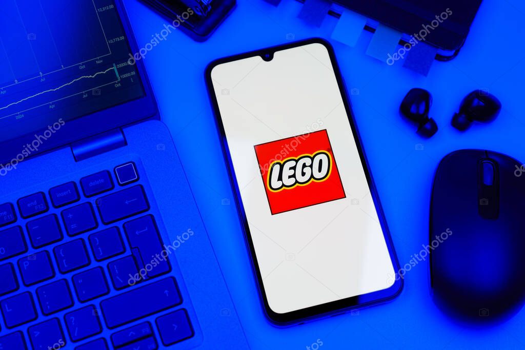 Prague, Czechia - 10 21 2024: Smartphone on surface showing Lego logo.