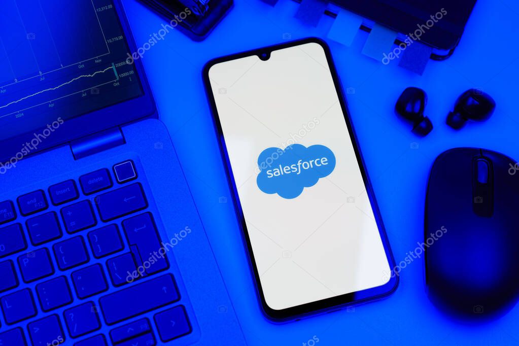 Prague, Czechia - 10 21 2024: Smartphone on surface showing Salesforce logo.