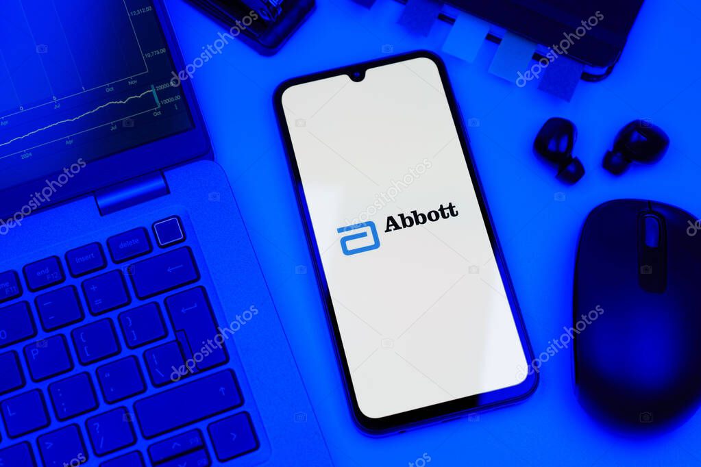 Prague, Czechia - 10 21 2024: Smartphone on surface showing Abbott Laboratories logo.