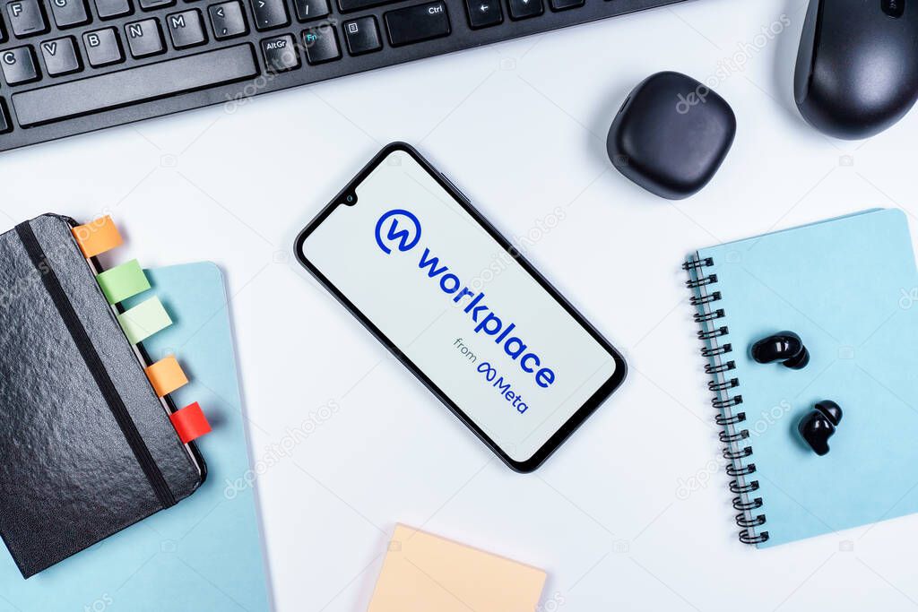 Prague, Czechia - 10 21 2024: Smartphone on surface showing Workplace logo.