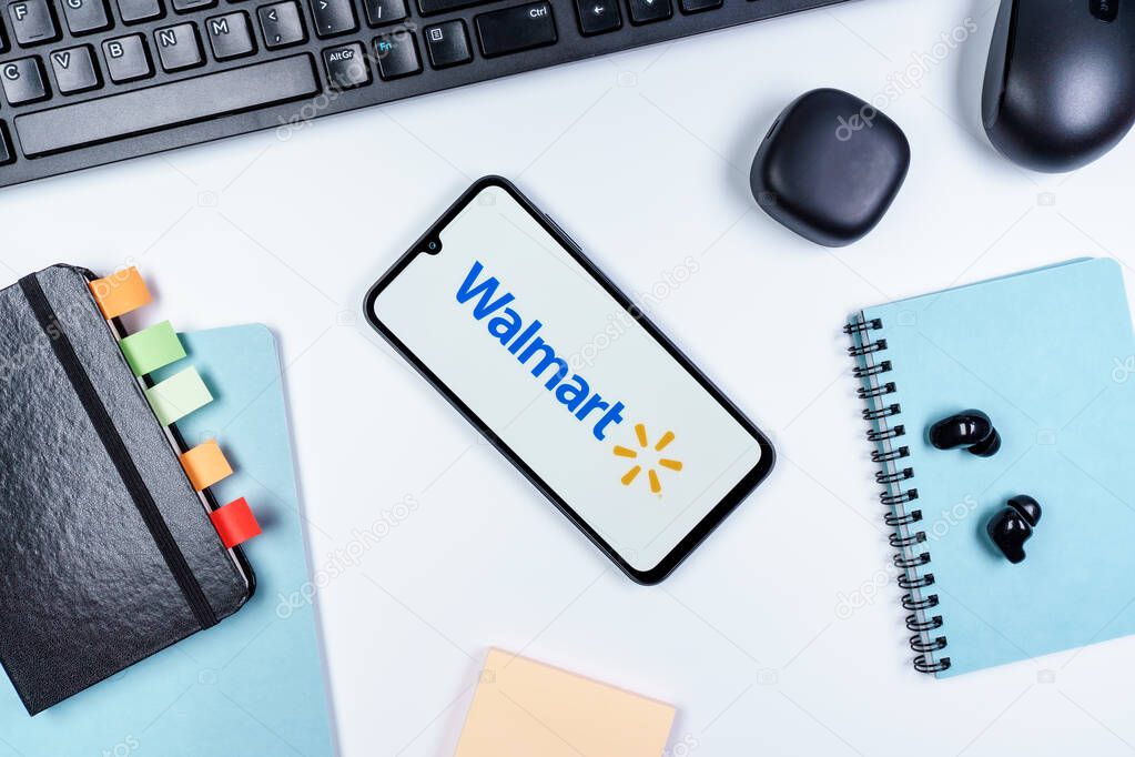 Prague, Czechia - 10 21 2024: Smartphone on surface showing Walmart logo.
