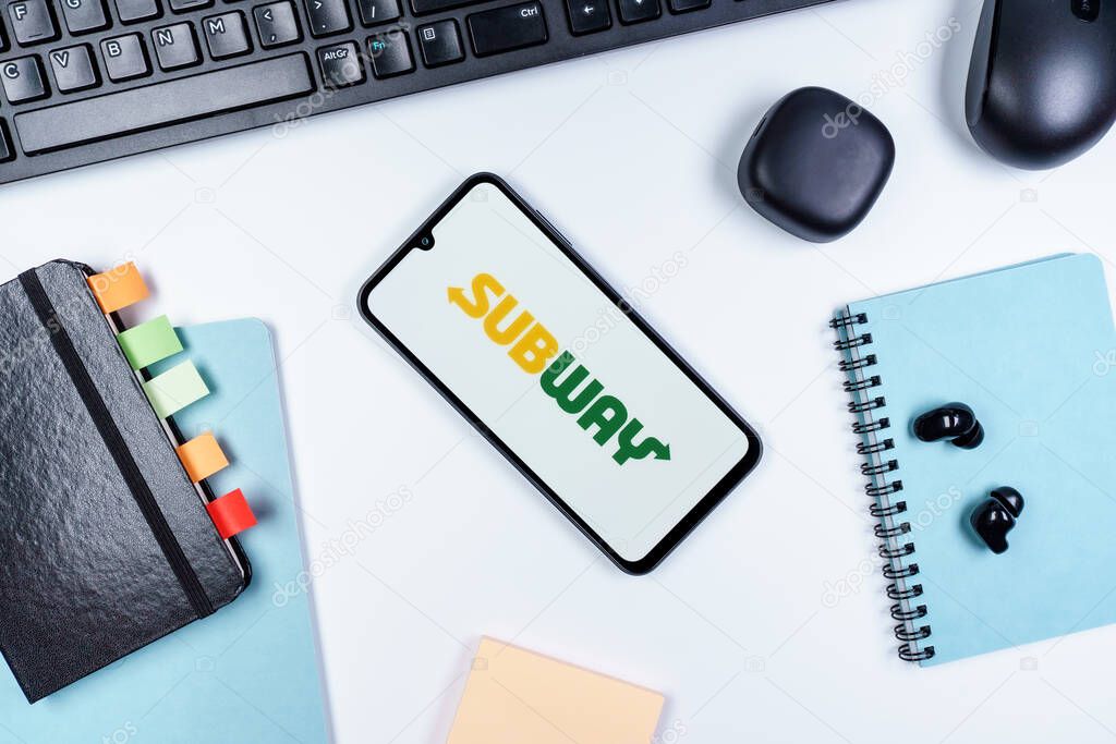 Prague, Czechia - 10 21 2024: Smartphone on surface showing Subway logo.
