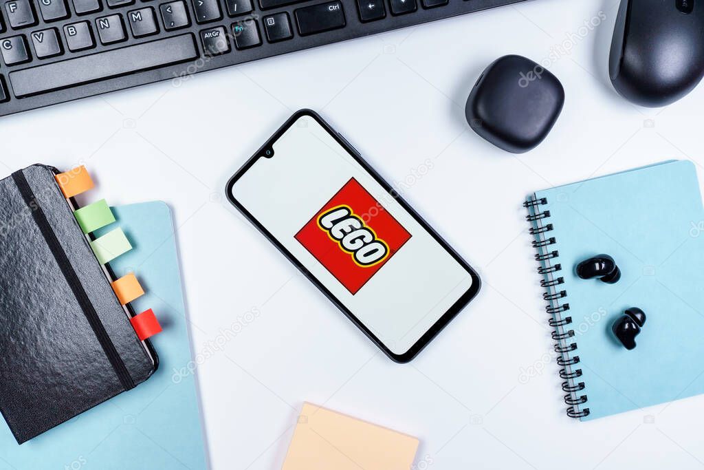 Prague, Czechia - 10 21 2024: Smartphone on surface showing Lego logo.