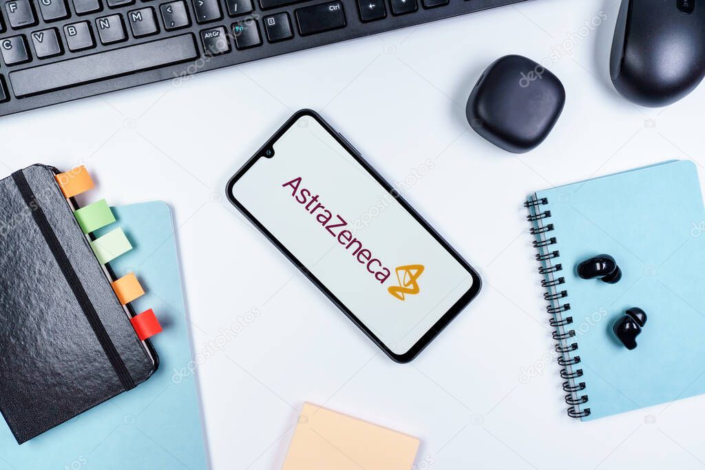 Prague, Czechia - 10 21 2024: Smartphone on surface showing AstraZeneca logo.
