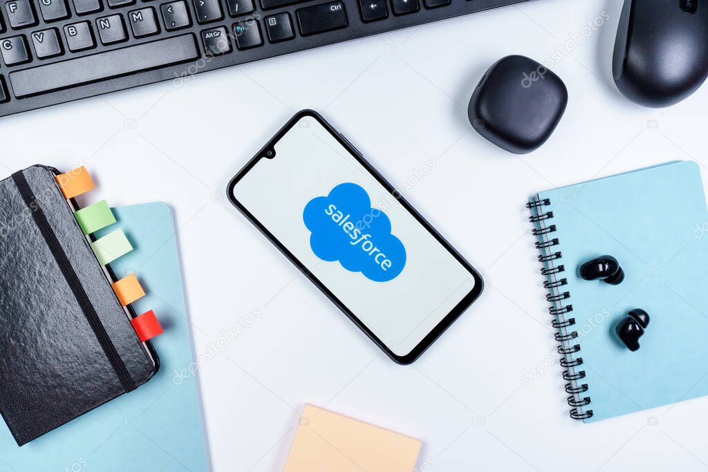 Prague, Czechia - 10 21 2024: Smartphone on surface showing Salesforce logo.