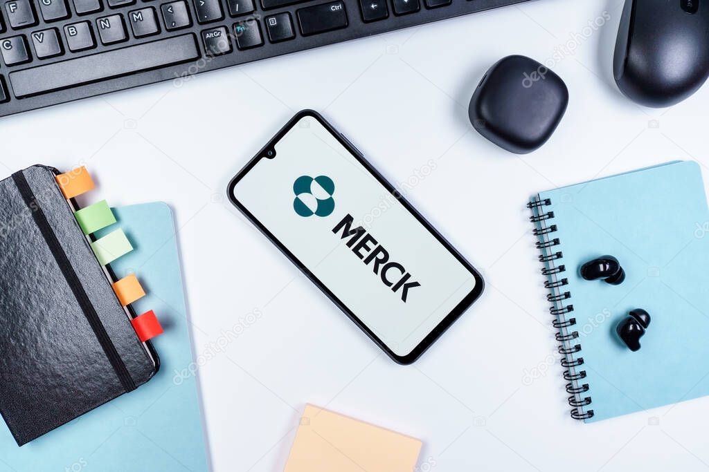 Prague, Czechia - 10 21 2024: Smartphone on surface showing Merck logo.