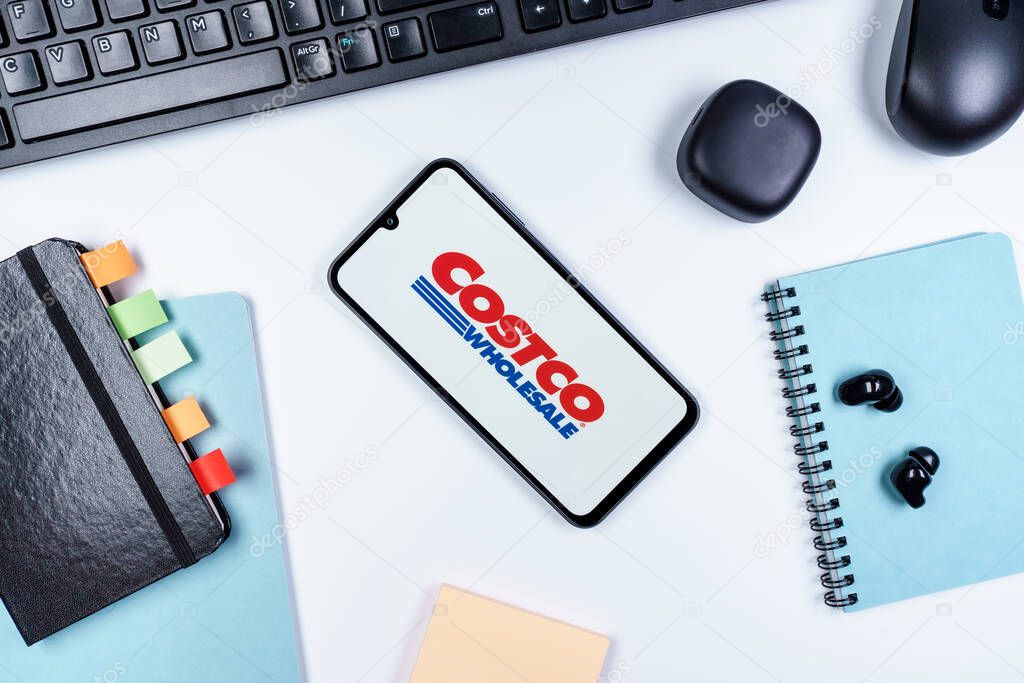 Prague, Czechia - 10 21 2024: Smartphone on surface showing Costco logo.