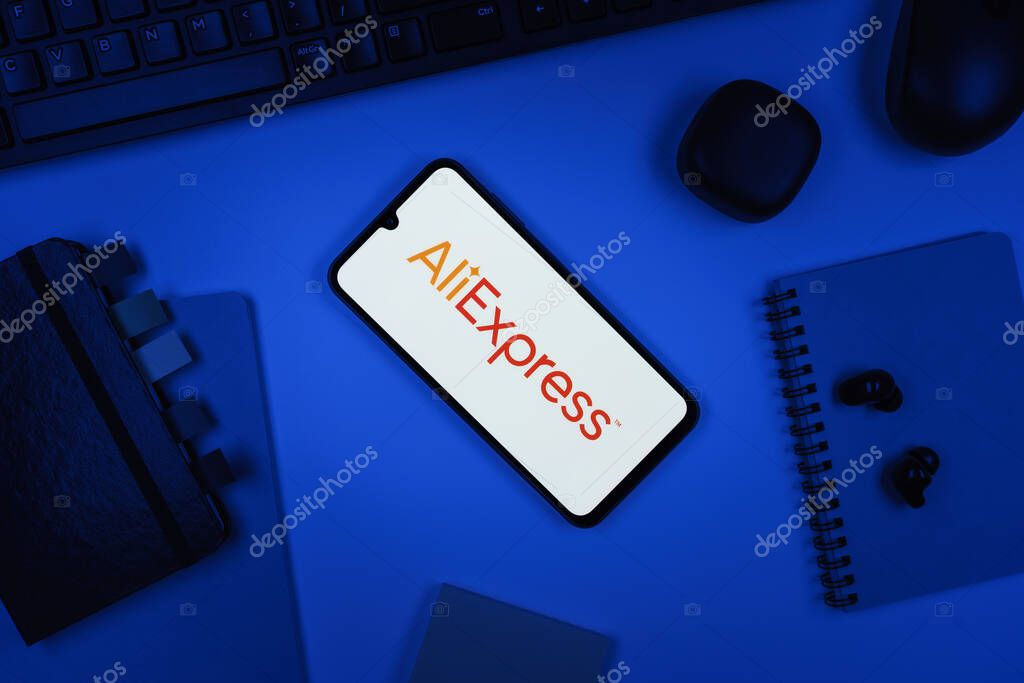 Prague, Czechia - 10 21 2024: Smartphone on surface showing AliExpress logo.