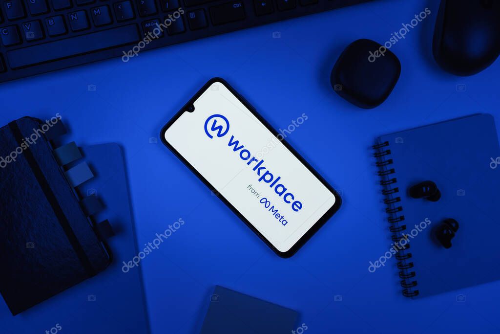 Prague, Czechia - 10 21 2024: Smartphone on surface showing Workplace logo.