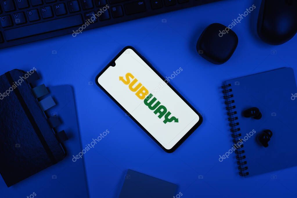 Prague, Czechia - 10 21 2024: Smartphone on surface showing Subway logo.