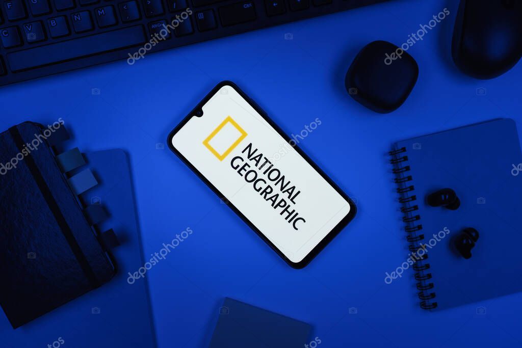 Prague, Czechia - 10 21 2024: Smartphone on surface showing National Geographic logo.