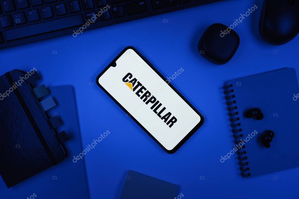 Prague, Czechia - 10 21 2024: Smartphone on surface showing Caterpillar logo.
