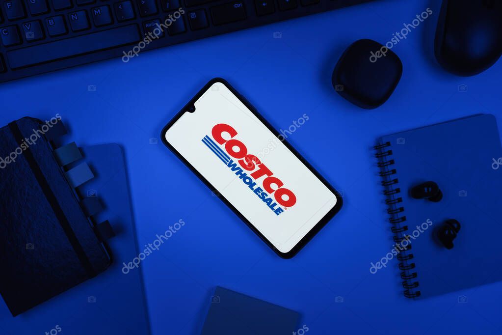 Prague, Czechia - 10 21 2024: Smartphone on surface showing Costco logo.