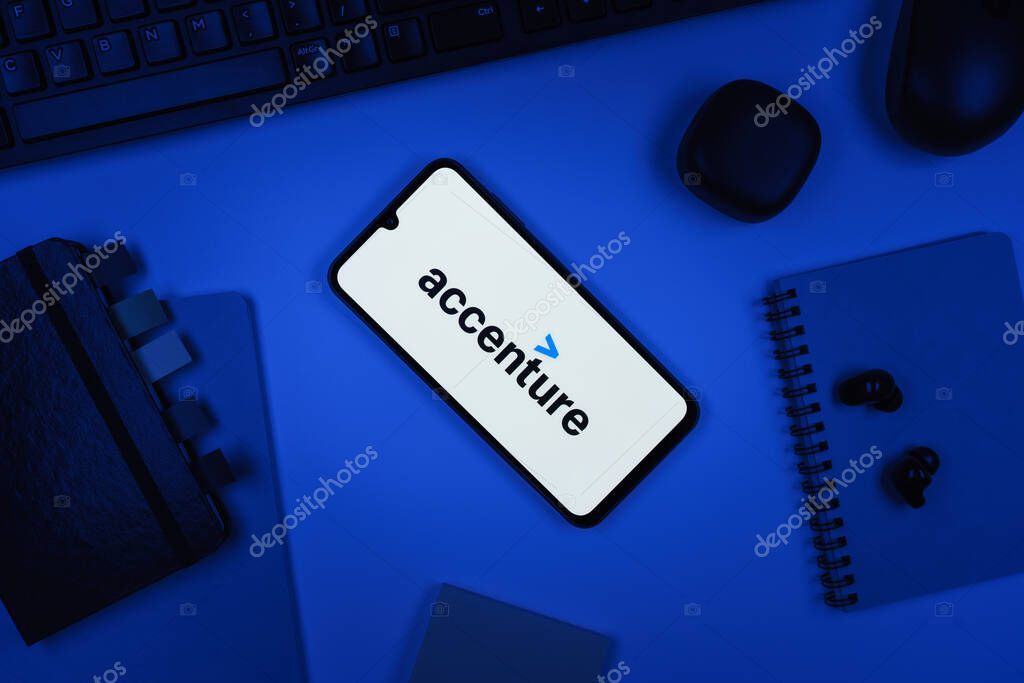 Prague, Czechia - 10 21 2024: Smartphone on surface showing Accenture logo.